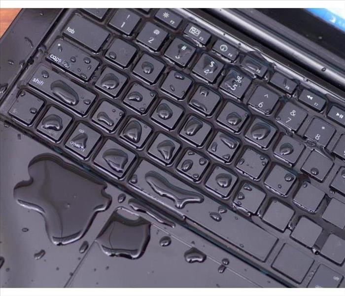 Keyboard of a computer with water